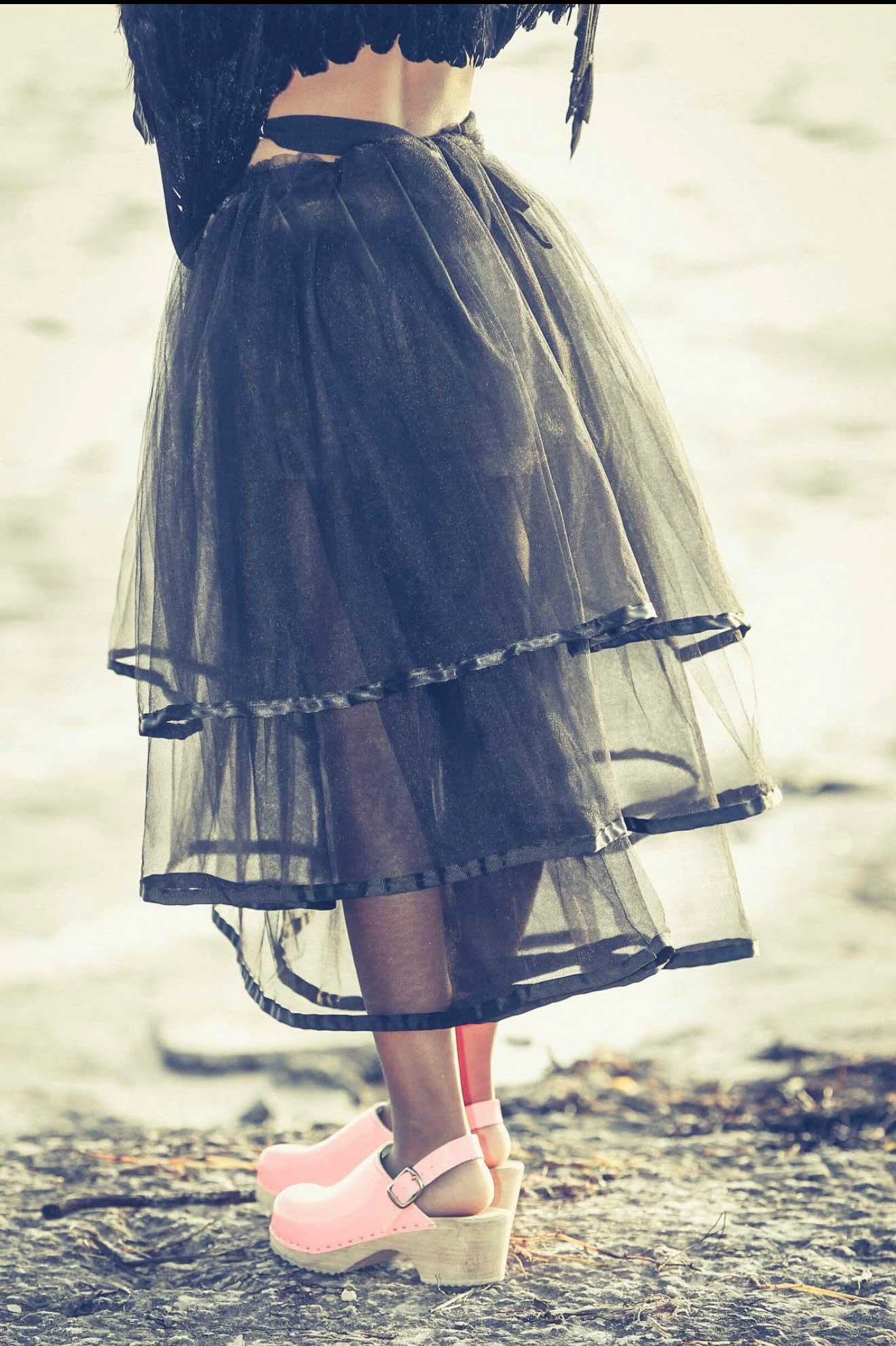Girl on beach with 3 tier tulle layered skirt.